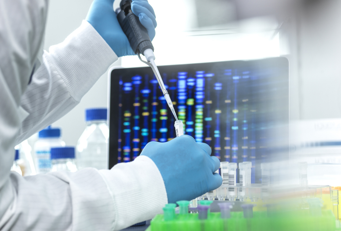 Scientist in a lab pipetting sample into a vial for DNA testing